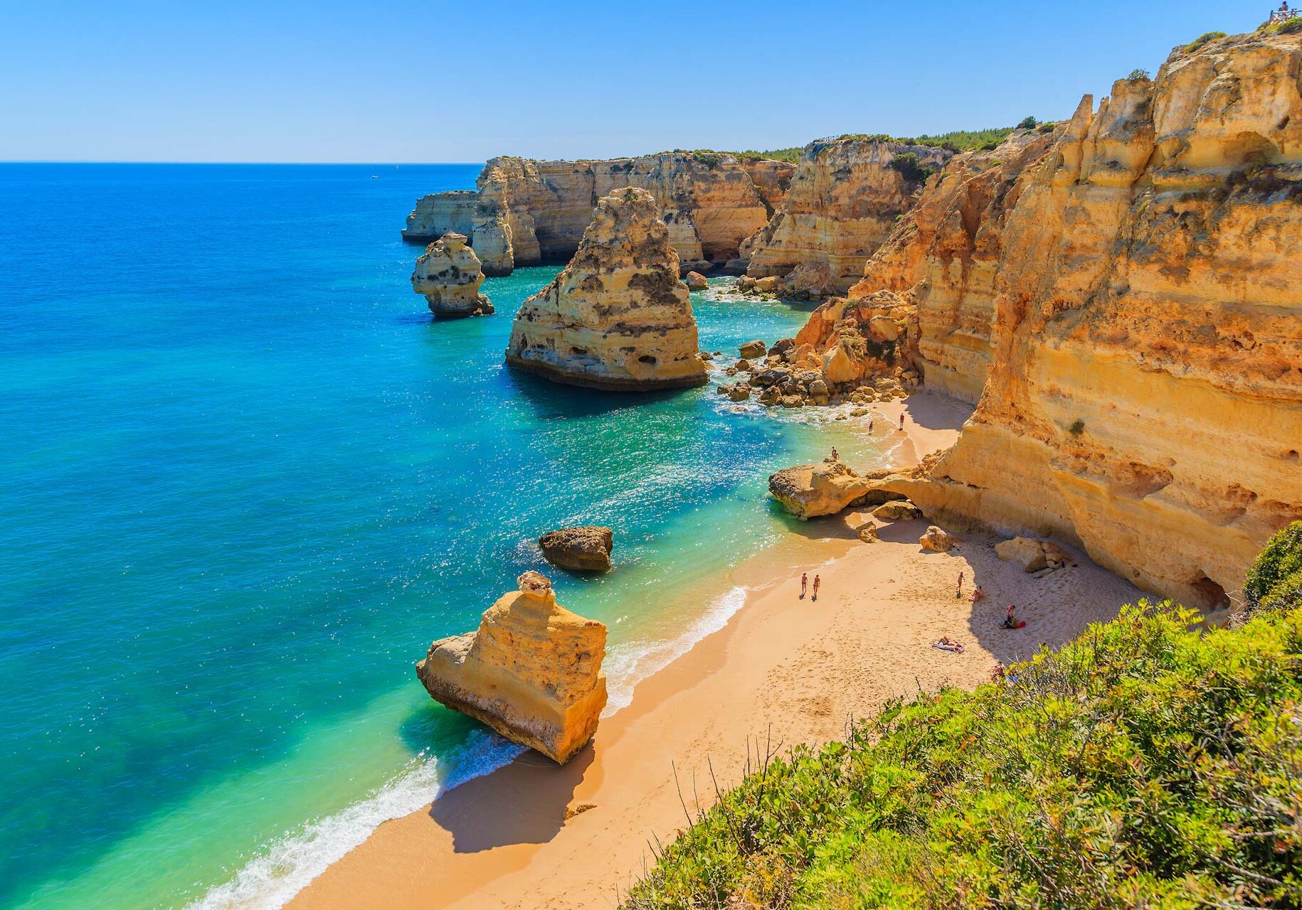 View of beautiful Marinha beach with crystal clear turquoise water near Carvoeiro town, Algarve region, Portugal